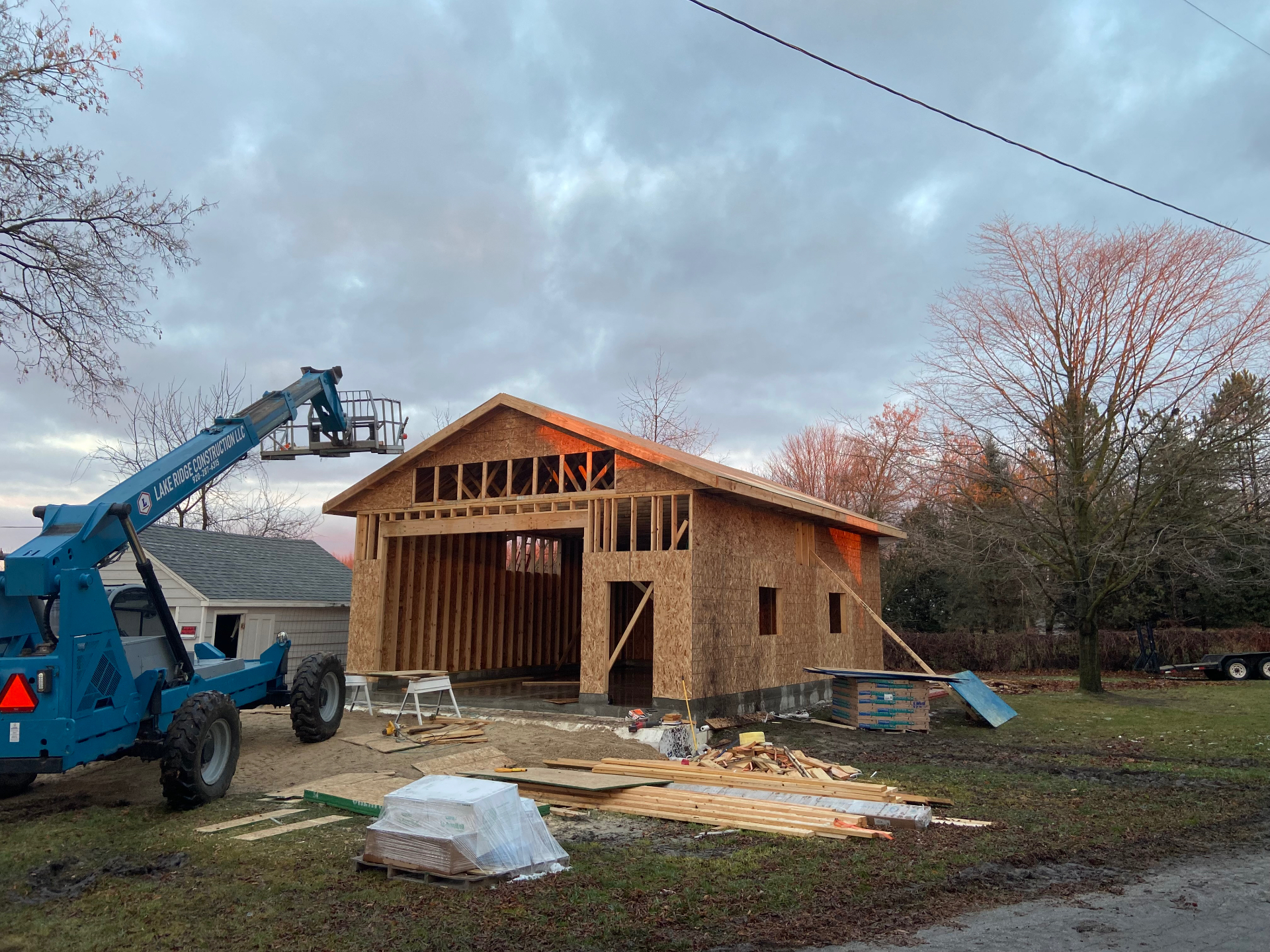 Detached garage being framed at sunset in Wisconsin