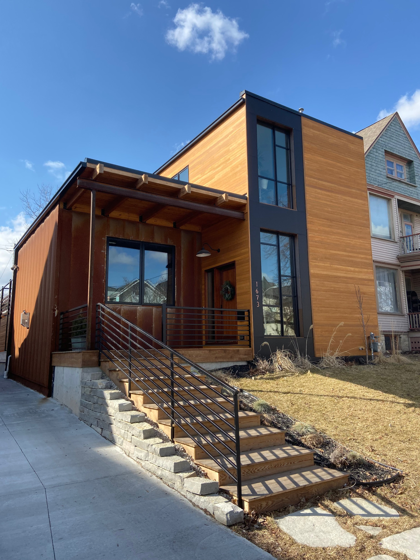 Modern custom-built home with cedar and corten steel siding in Wisconsin